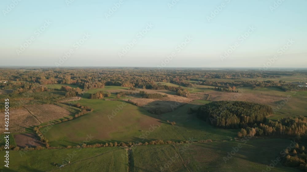 AERIAL: Forest with Plains on a Summer Evening During Golden Hour AERIAL: Forest with Plains on a Summer Evening During Golden Hour