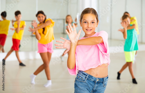 Dance class for kids, positive girls and boys training in dance studio © JackF