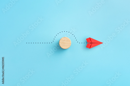 Business for solution concept. red paper plane with wooden block
