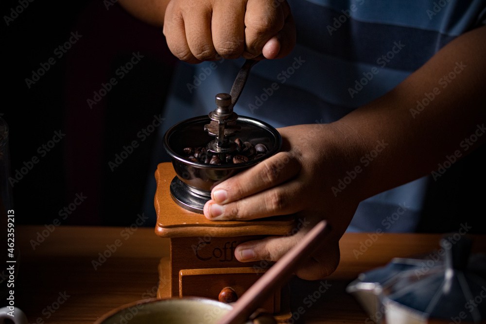 Hand spinning the coffee bean grinder grind enough coffee. Hand spinning the coffee bean grinder grind enough coffee.