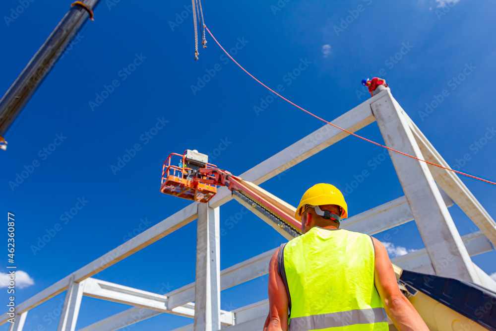 Boss oversees, control managing concrete joist for assembly huge concrete construction Boss oversees, control managing concrete joist for assembly huge concrete construction