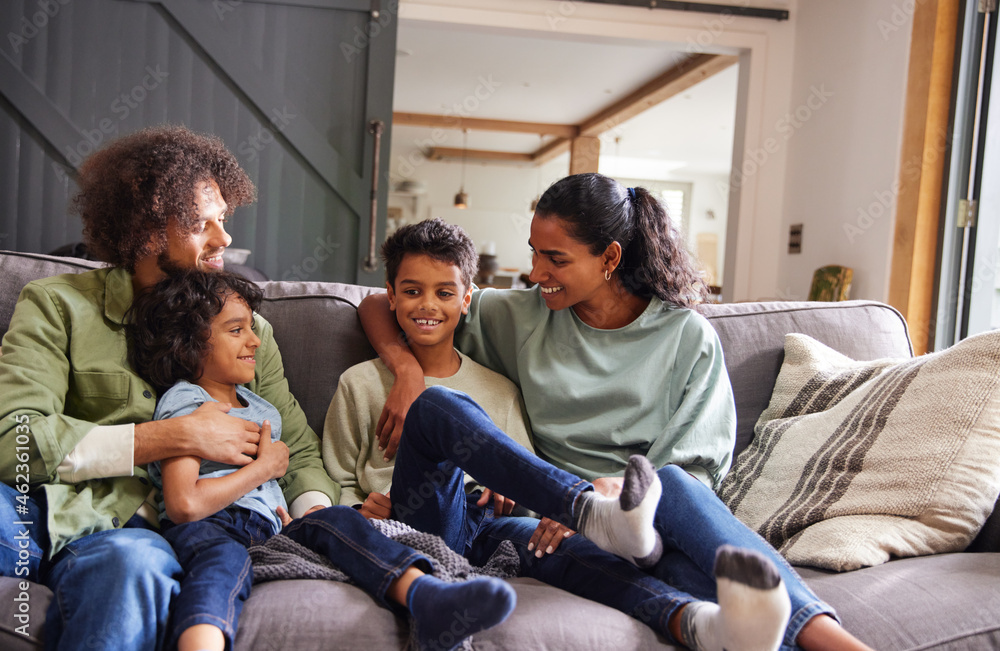 Portrait of happy family on sofa Portrait of happy family on sofa
