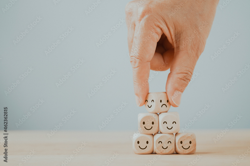 hand flip wooden cube, bad emoticon to happy, mental health assessment, world mental health day, change attitude  concept - obrazy, fototapety, plakaty 