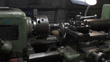 Working process with metal details on lathe in workplace