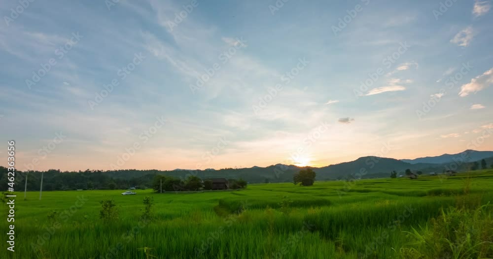 Time lapse changing the color of the sky from evening sunset until dusk over the mountains with paddy terrace fields at Mae Hong Son province Northern Thailand. Time lapse changing the color of the sky from evening sunset until dusk over the mountains with paddy terrace fields at Mae Hong Son province Northern Thailand.