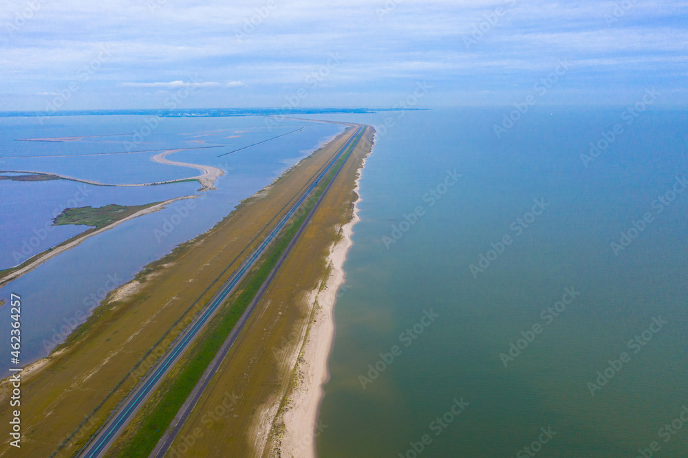 Drone photography of an artificial island called Houtribdijk in Lake Markermeer in the provinz Flevoland.  The highway dyke N302 from Lelystad to Enkhuizen. Flevoland, The Netherlands.