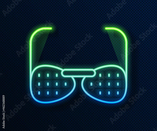 Glowing neon line Glasses for the blind and visually impaired icon isolated on blue background. Vector