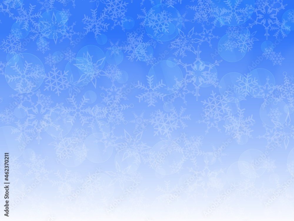 光と雪の結晶の青色の背景