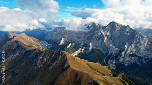 Mountain landscape with lake and clouds in the Italian Dolomites view from above