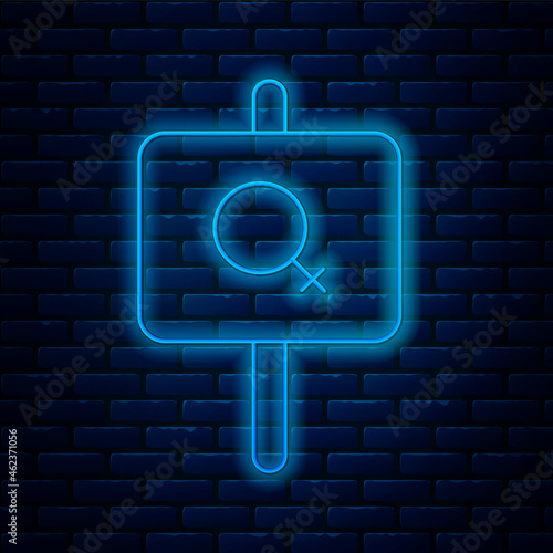 Glowing neon line Female movement, feminist activist with banner and placards icon isolated on brick wall background. Feminist rights movement, feminism sisterhood. Vector