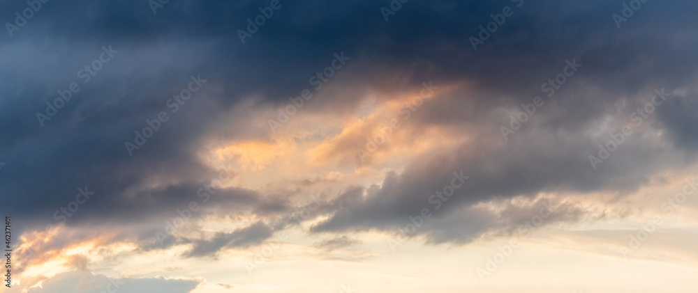Dramatic sky with dark clouds at sunset