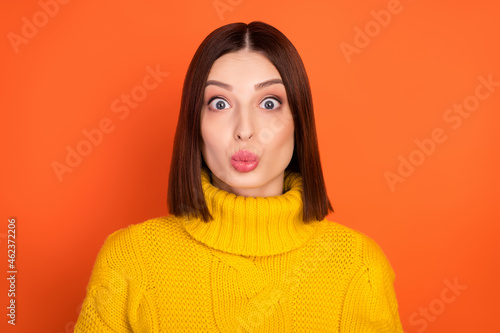 Photo of young attractive woman pouted lips send air kiss flirty romantic isolated over orange color background © deagreez