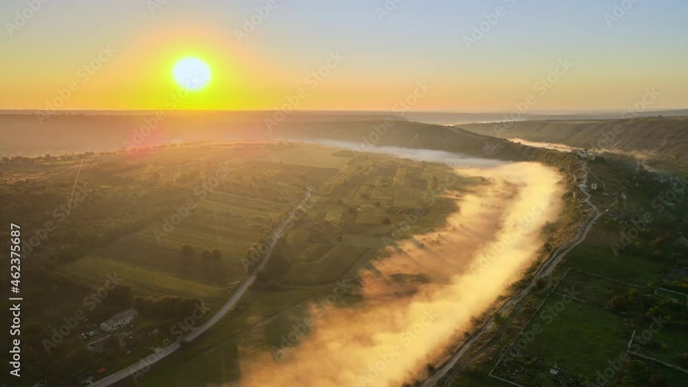 Aerial drone view of the Old Orhei at sunset. Valley with river and fog, village, monastery located on a hill in Moldova Aerial drone view of the Old Orhei at sunset. Valley with river and fog, village, monastery located on a hill in Moldova