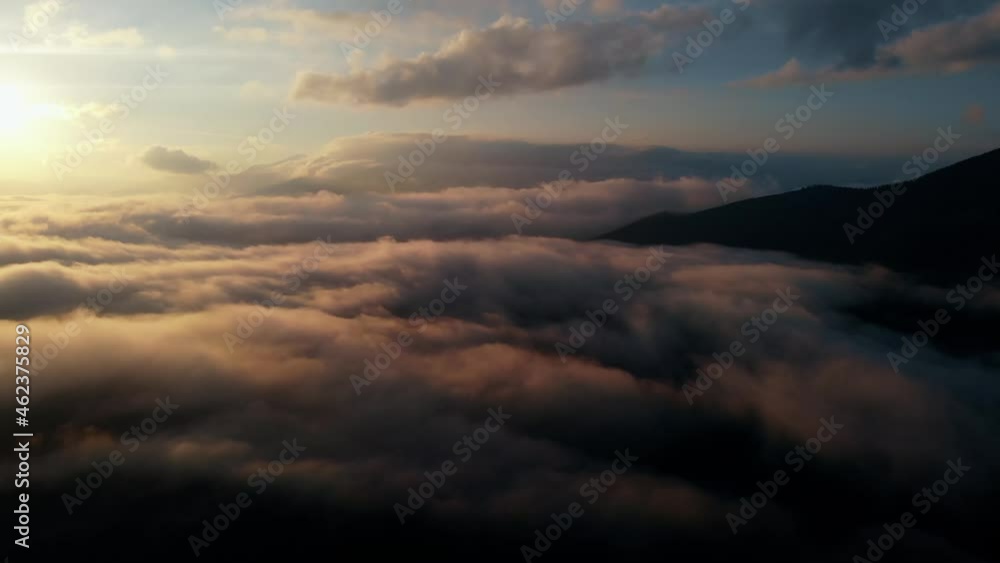 Aerial view: Flying Over Clouds on Sun Rise in Mountains. Aerial view: Flying Over Clouds on Sun Rise in Mountains.