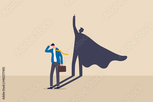 Self confidence or leadership to bring full potential and strength, motivation to achieve business success concept, self doubt businessman standing with his skillful power superhero shadow on the wall photo