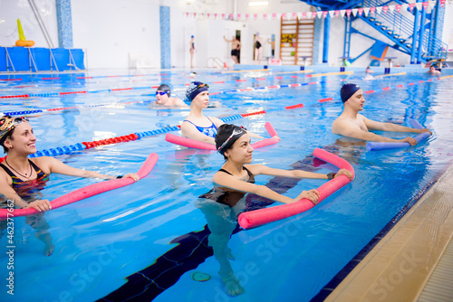 Aqua aerobics training in the water sports center. © nagaets
