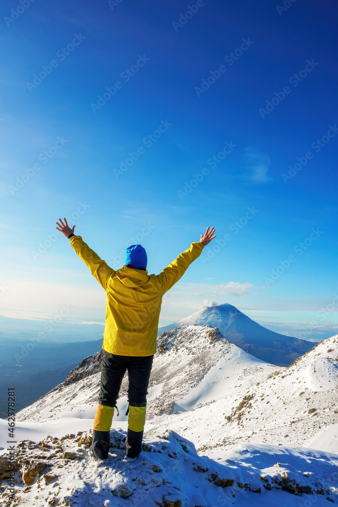 woman hiker open arms on iztaccihuatl volcano top woman hiker open arms on iztaccihuatl volcano top