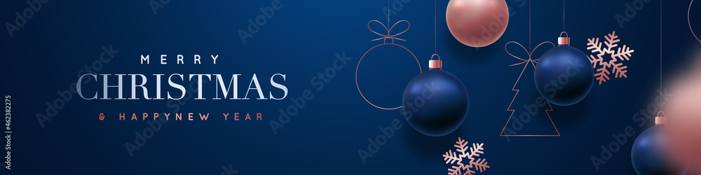 Merry Christmas and Happy New Year vector banner. Realistic rose gold and blue baubles, snowflakes hanging on dark blue background. Christmas balls motion blur effect. Luxury background.
