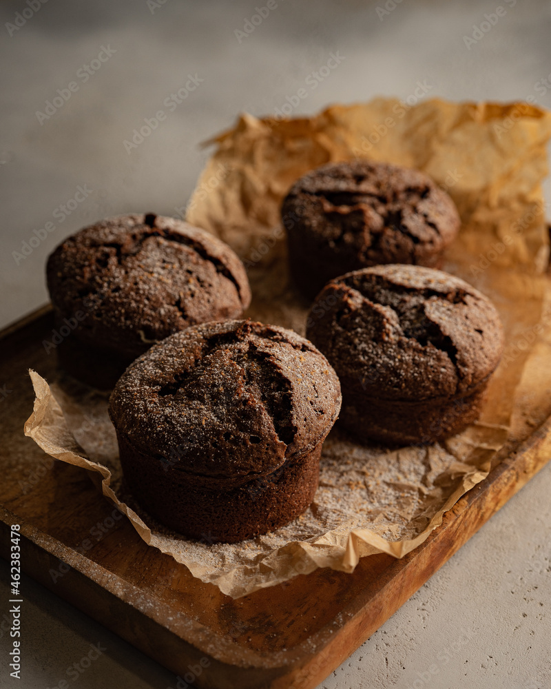 chocolate muffins on cutting board chocolate muffins on cutting board
