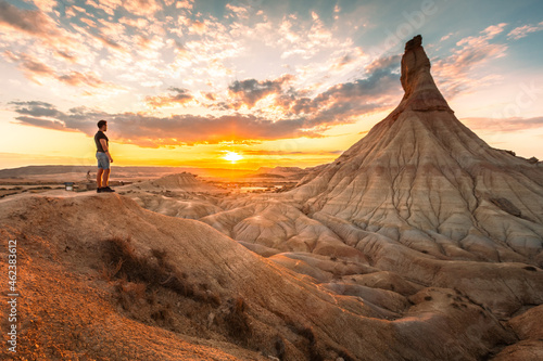 Young adult at famous Castildetierra natural monument at Bardenas Reales desert, Navarra, Basque Country.