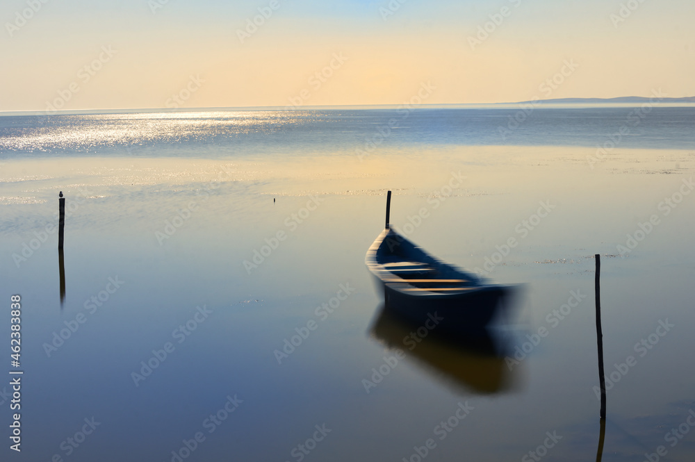 Long exposure Boat In The Calm Water on Razim Lake