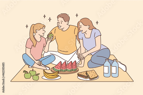 Having picnic and leisure time with family concept. Smiling happy family father mother daughter sitting together eating fruits having picnic vector illustration 