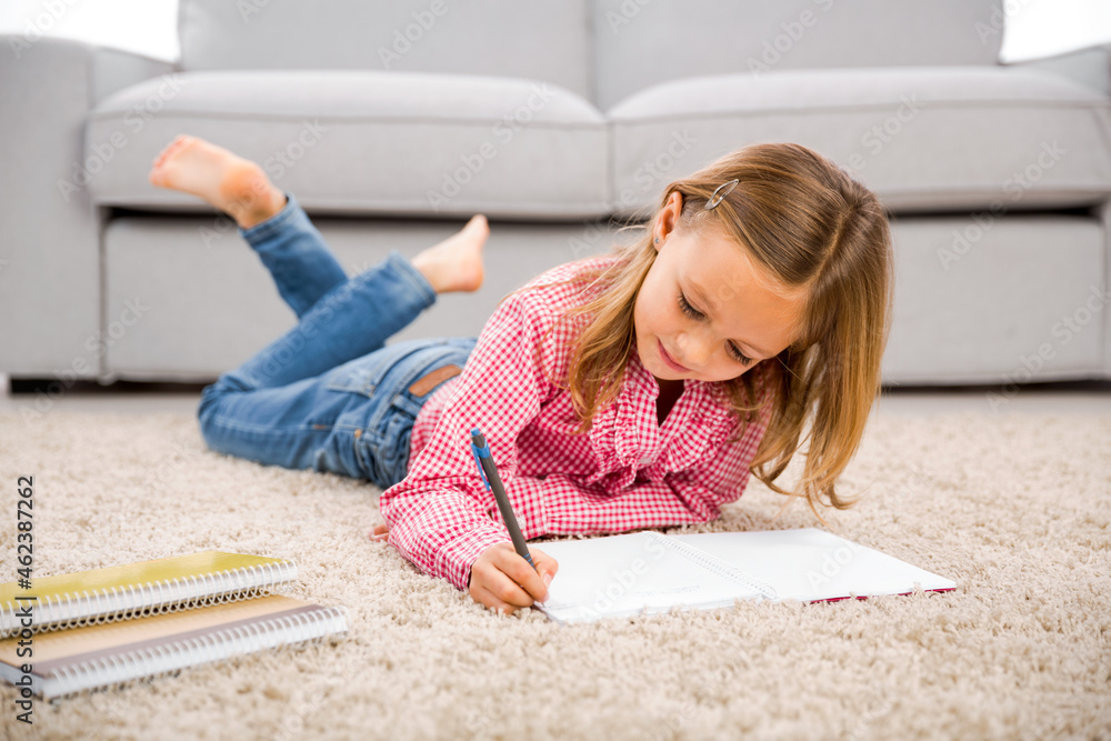 Little girl making homework