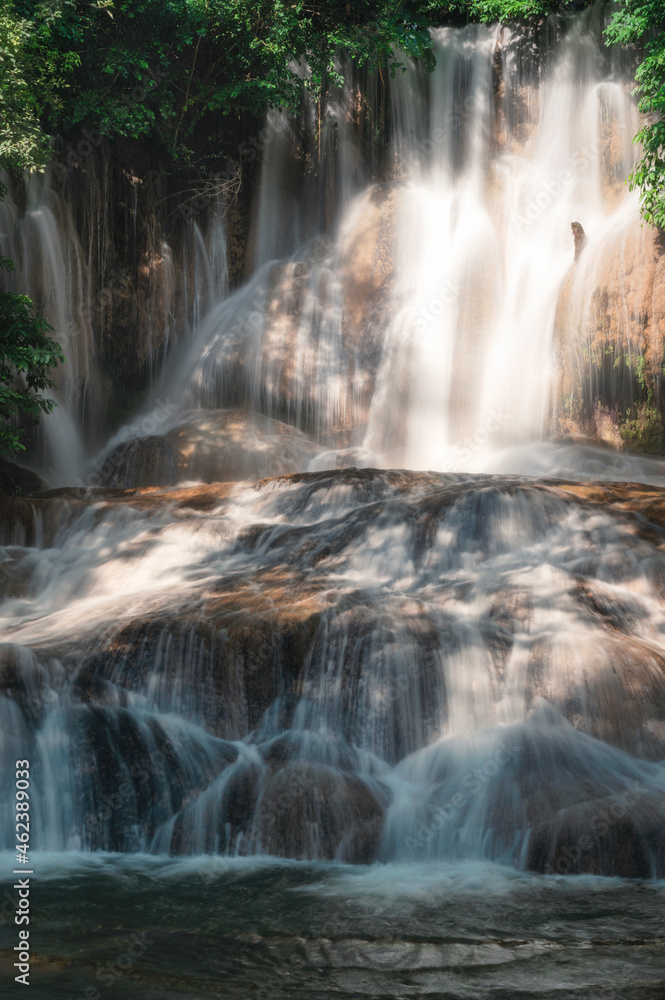 Sai Yok Noi waterfall flowing on limestone in tropical rainforest at national park Sai Yok Noi waterfall flowing on limestone in tropical rainforest at national park