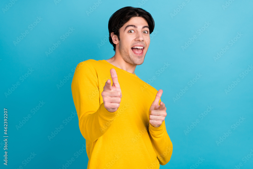 Photo portrait man selecting pointing fingers at you smiling isolated pastel blue color background Photo portrait man selecting pointing fingers at you smiling isolated pastel blue color background