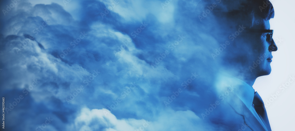 Abstract head in clouds concept. Man portrait silhouette on white sky background with mock up place. Double exposure.