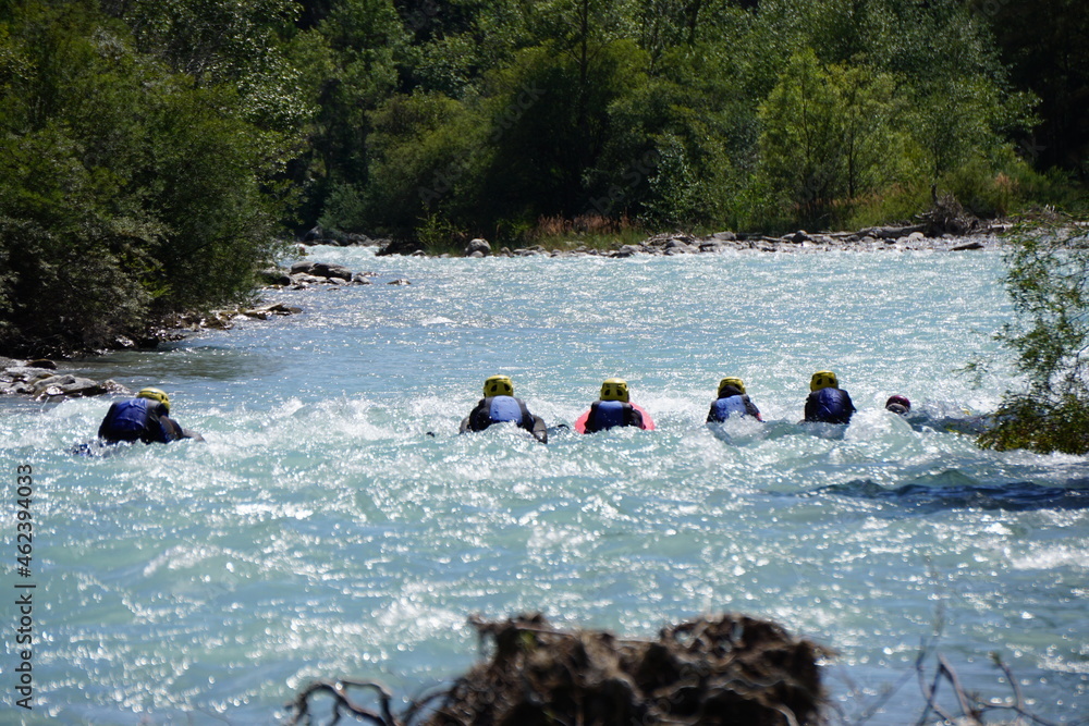 group of people  floating in the river durance, alps france
