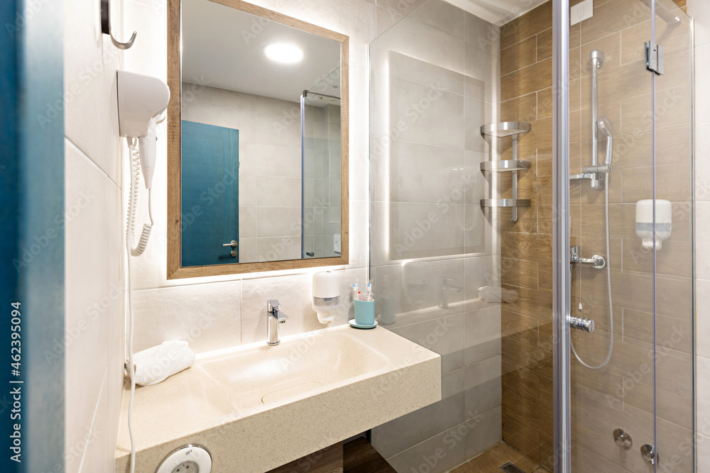 Interior of a hotel bathroom with a shower cabin Interior of a hotel bathroom with a shower cabin