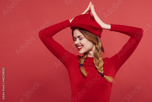 cheerful woman in a red sweater cosmetics emotion studio posing © SHOTPRIME STUDIO