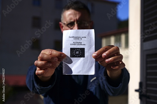 person showing the pass for the covid