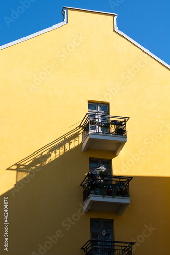 yellow building with little balconies