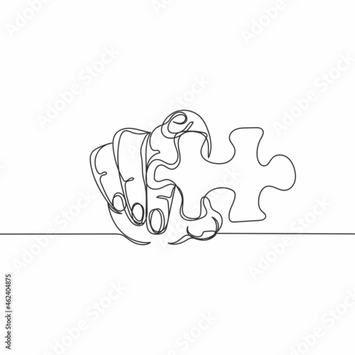 Continuous one line drawing of businessman holds a piece of puzzle in silhouette on a white background. Linear stylized.