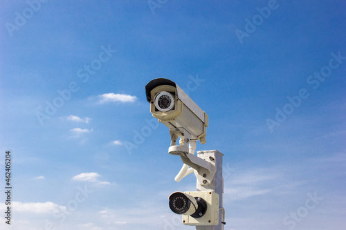 security camera on blue sky
