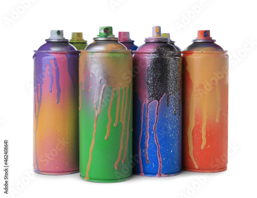 Used cans of spray paints on white background. Graffiti supplies