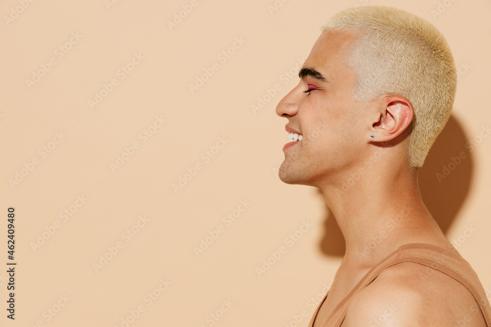Side view young attractive smiling blond twink latin gay man 20s with make  up closed eyes