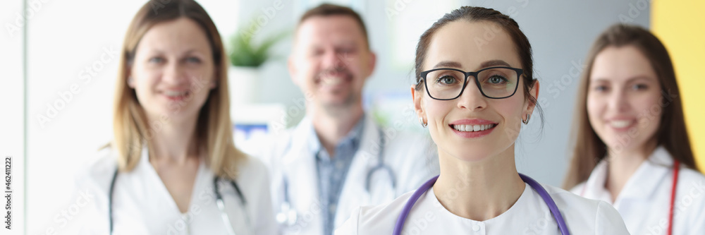 Portrait of medical team standing with clipboard in hospital Portrait of medical team standing with clipboard in hospital