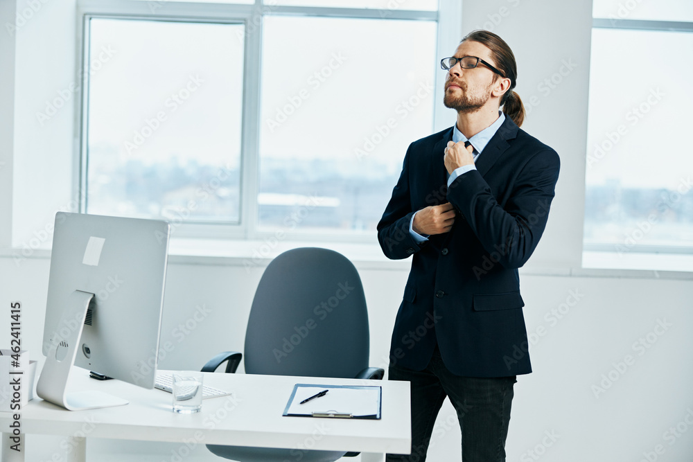 male manager near the desktop work process computer male manager near the desktop work process computer