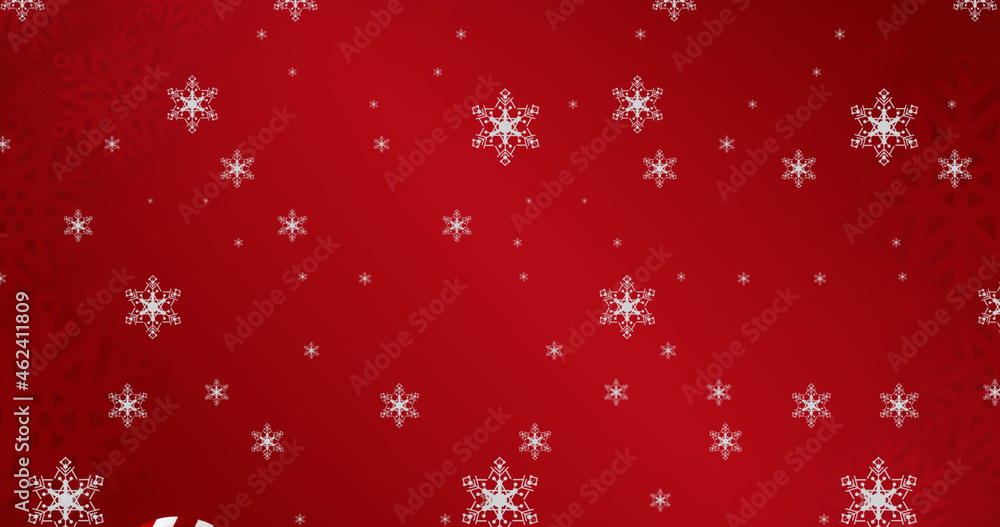 Image of falling snowflakes over christmas gift and candy canes
