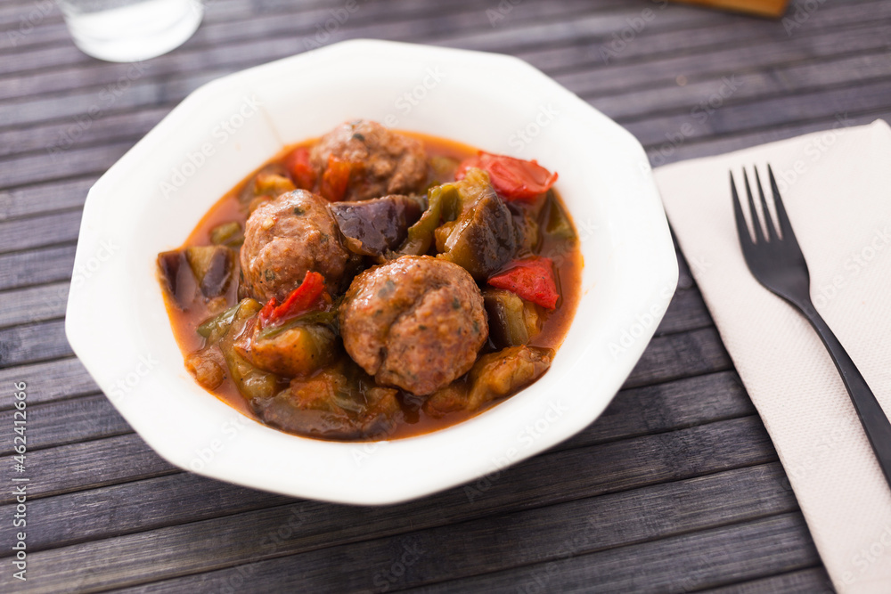 cooked meatballs with stewed eggplant in bowl cooked meatballs with stewed eggplant in bowl