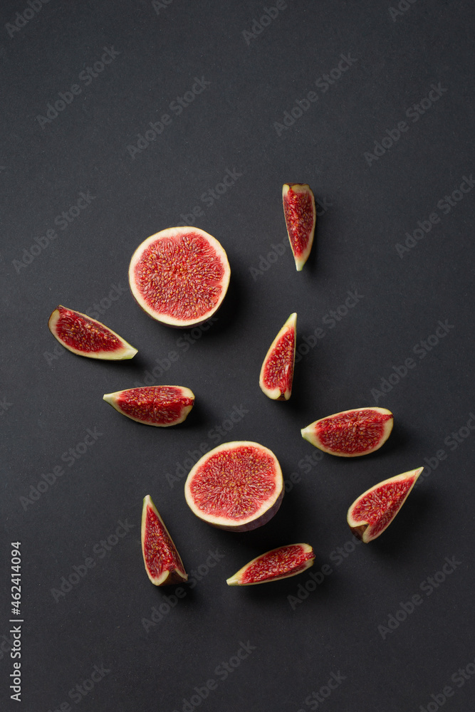 Fototapeta premium Fresh fig fruits cutted in pieces top view photo