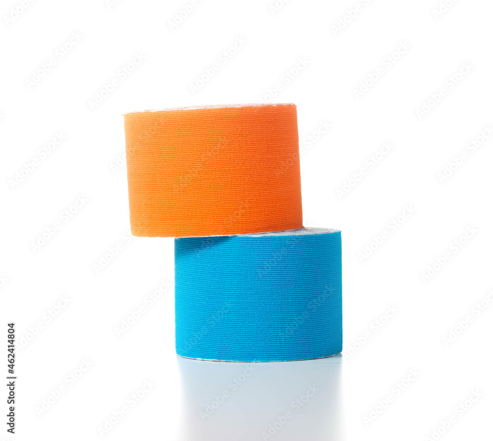 Obraz premium Blue and orange medical kinesiology tape on a white background. Isolate, teping, close-up