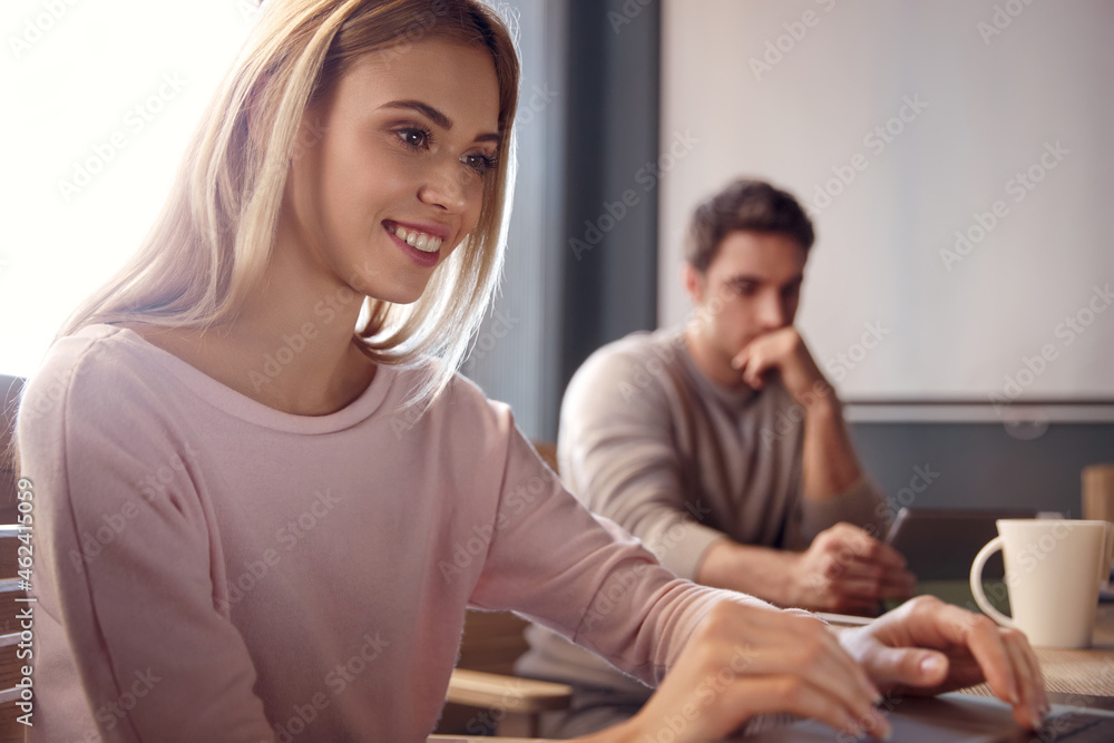 Business team working together at desk in office Business team working together at desk in office