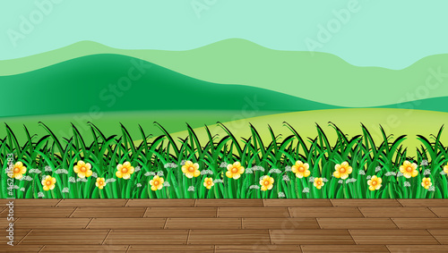 Flower field and green grass with mountain backdrop