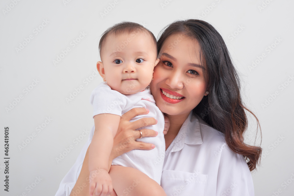 happy family mother playing and hug with baby daughter happy family mother playing and hug with baby daughter