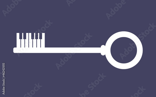 Vintage key with piano keys as the wards. Negative space effect. 