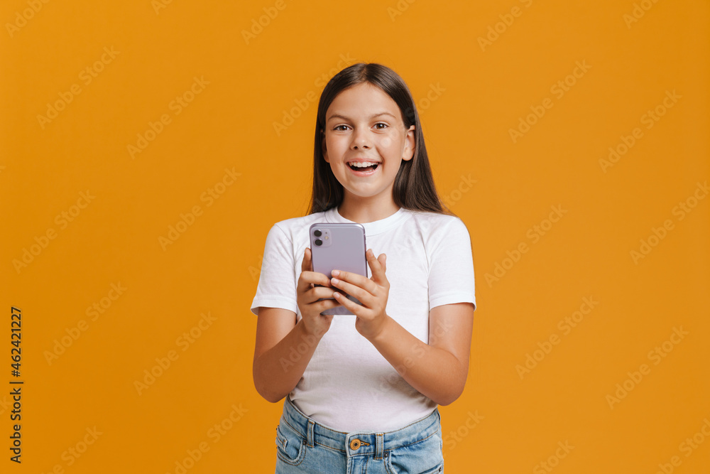 White brunette girl smiling while using mobile phone White brunette girl smiling while using mobile phone